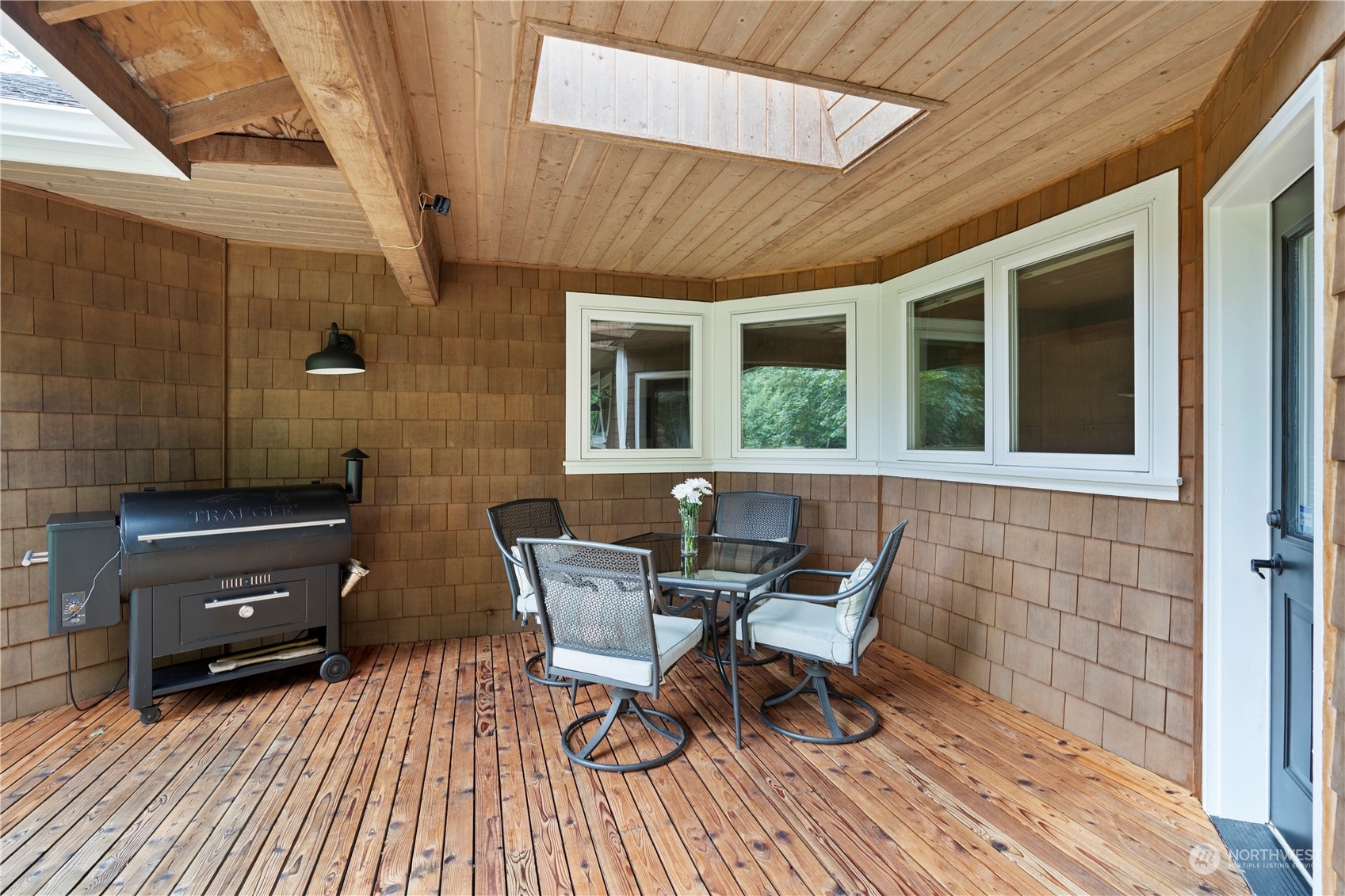 2109 Grove Road Northwest Olympia, WA 98502 - Photo 32 of 40 a view of a house with chairs and wooden floor