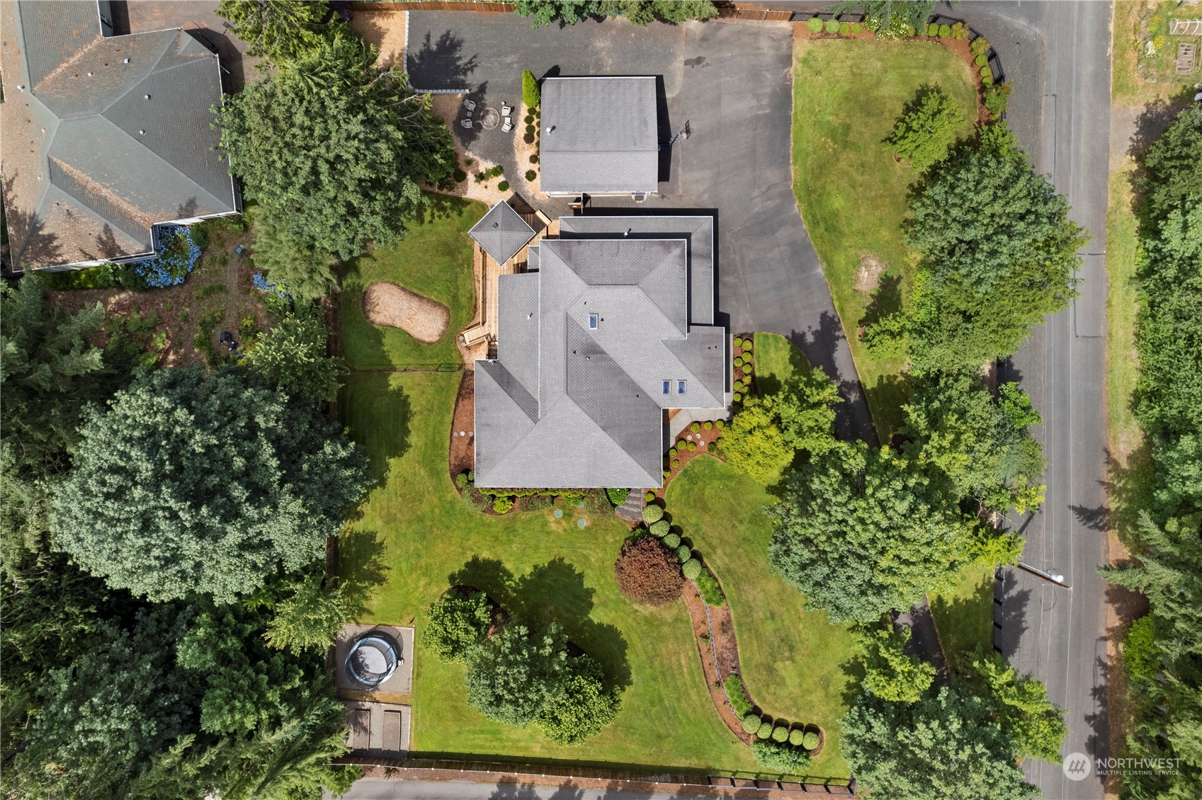2109 Grove Road Northwest Olympia, WA 98502 - Photo 33 of 40 an aerial view of a house with a yard and garden