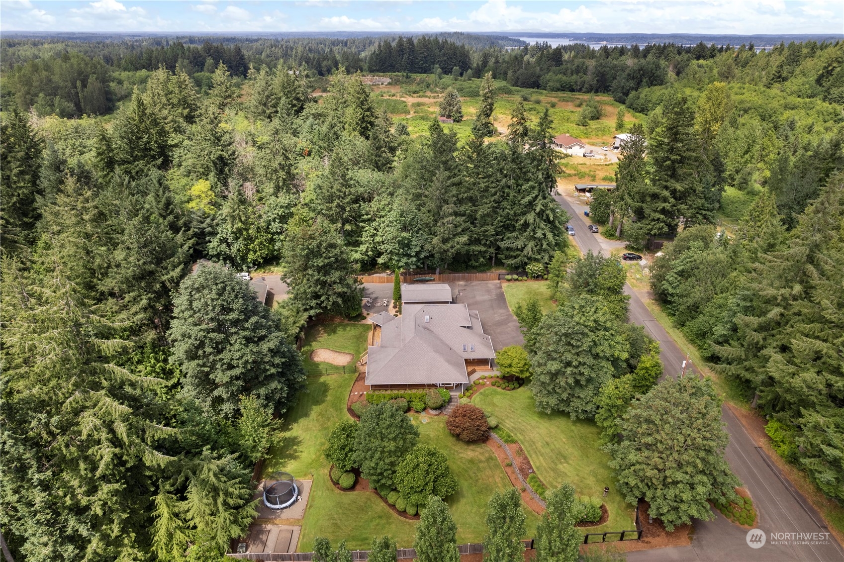 2109 Grove Road Northwest Olympia, WA 98502 - Photo 34 of 40 an aerial view of a house with a yard and lake view