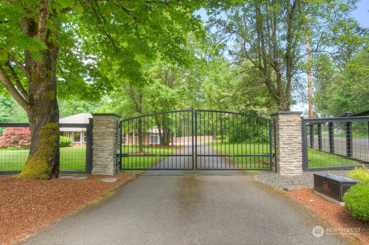 2109 Grove Road Northwest Olympia, WA 98502 - Photo 40 of 40 a view of a fence and trees in the background