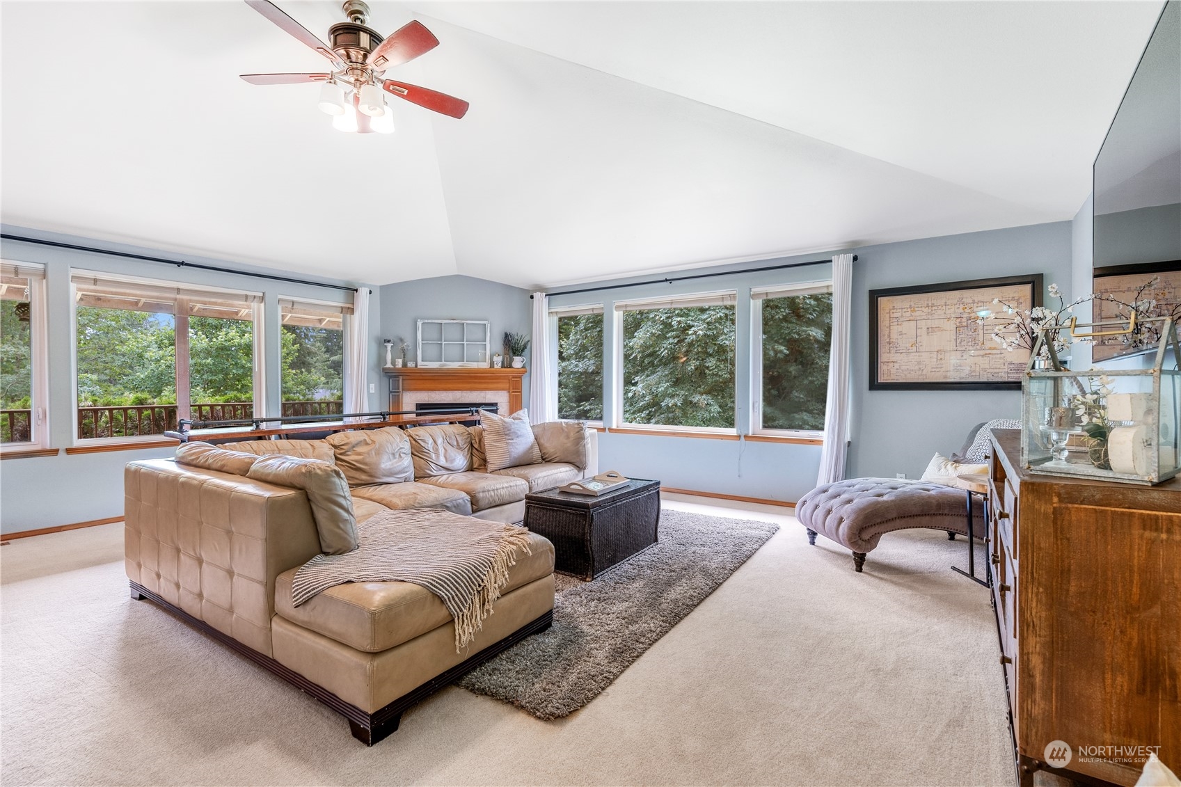 2109 Grove Road Northwest Olympia, WA 98502 - Photo 7 of 40 a living room with furniture a flat screen tv and a large window