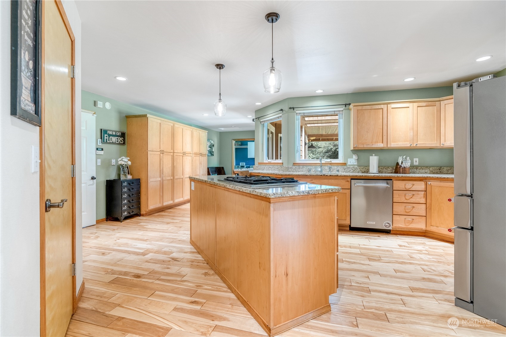 2109 Grove Road Northwest Olympia, WA 98502 - Photo 9 of 40 a kitchen with stainless steel appliances granite countertop a sink a stove and a refrigerator