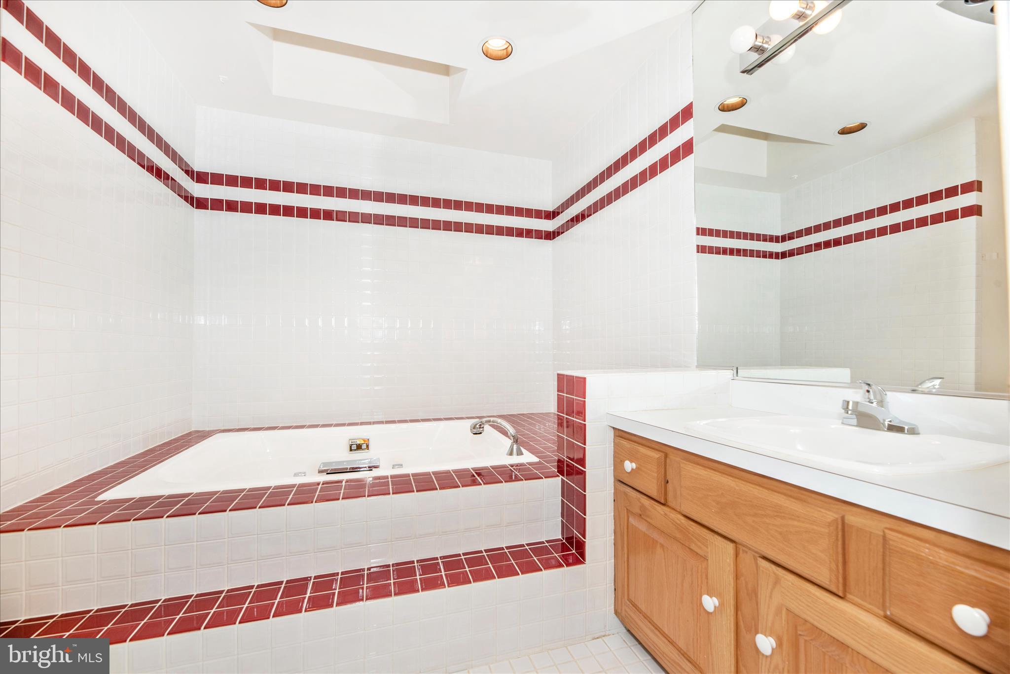 2221 Gold Mine Road Brookeville, MD 20833 - Photo 33 of 60 a bathroom with a sink and a bathtub