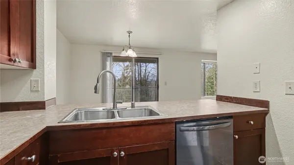 a kitchen with a sink and a window