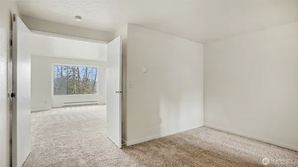 a view of an empty room with a window