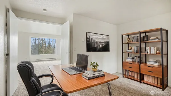 a workspace with furniture and window