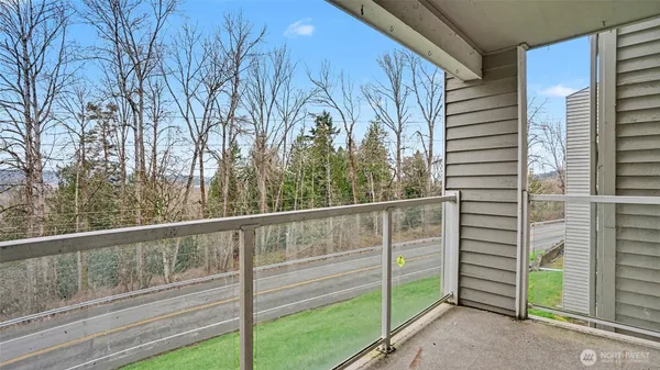 a bathroom with a shower and a glass door