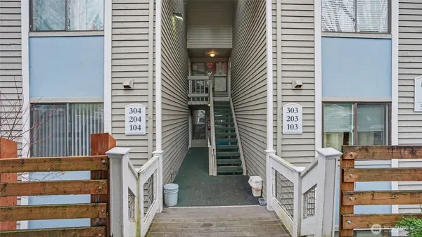 a view of a balcony with chairs