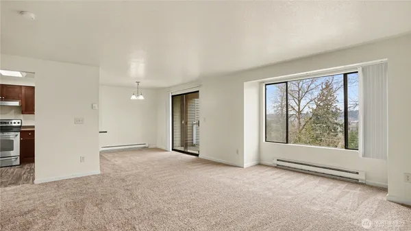 a view of an empty room with a window