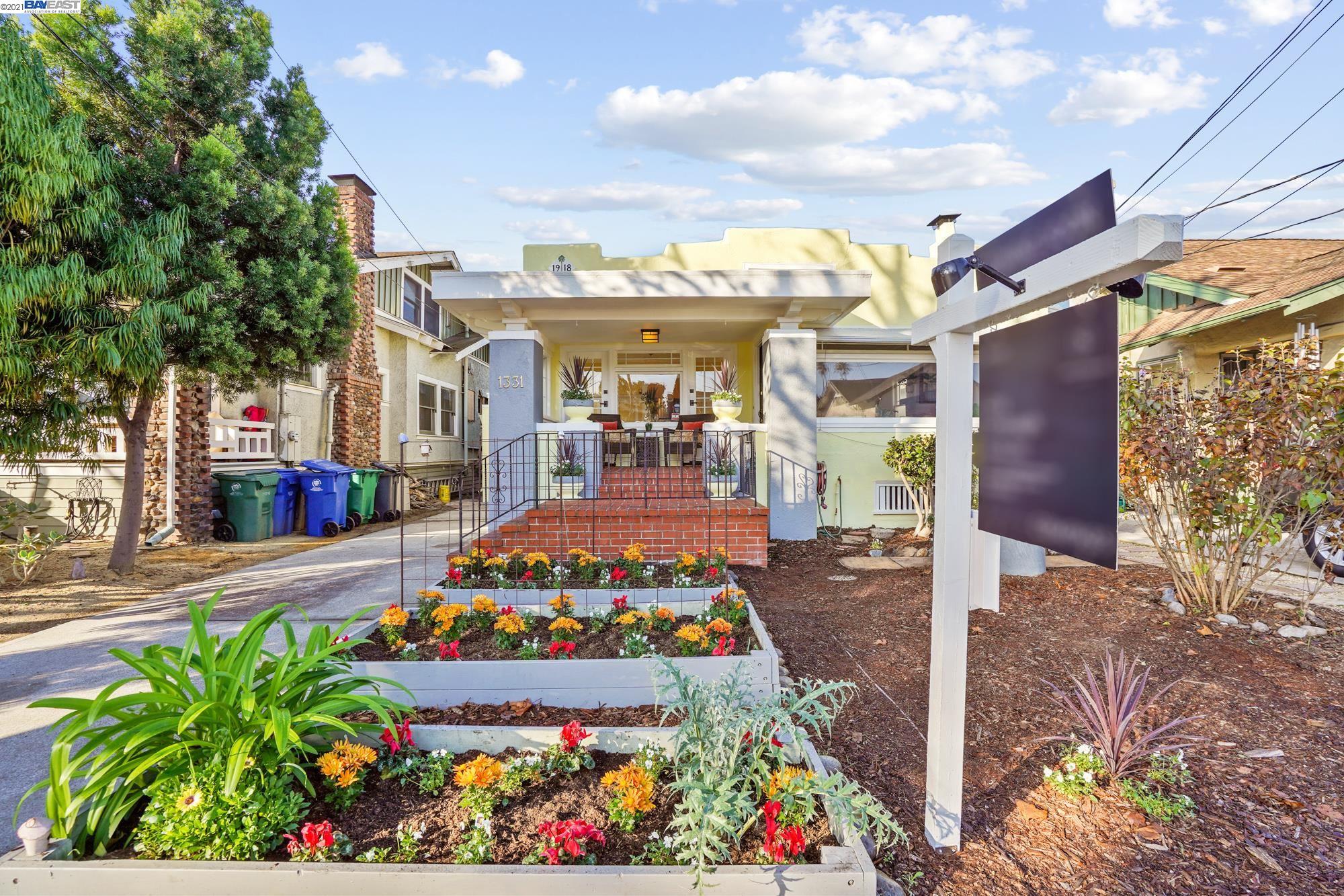 a front view of a multi story building with yard