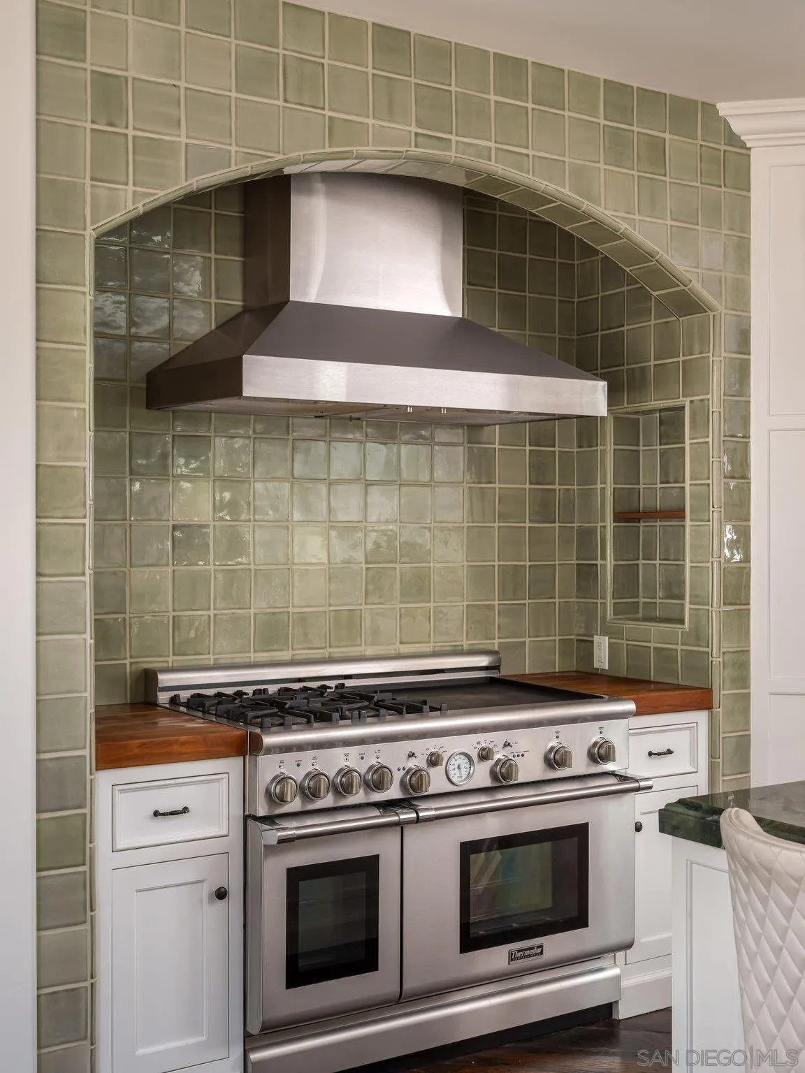14910 Rancho Nuevo Del Mar, CA 92014 - Photo 11 of 60 a stove top oven sitting inside of a kitchen