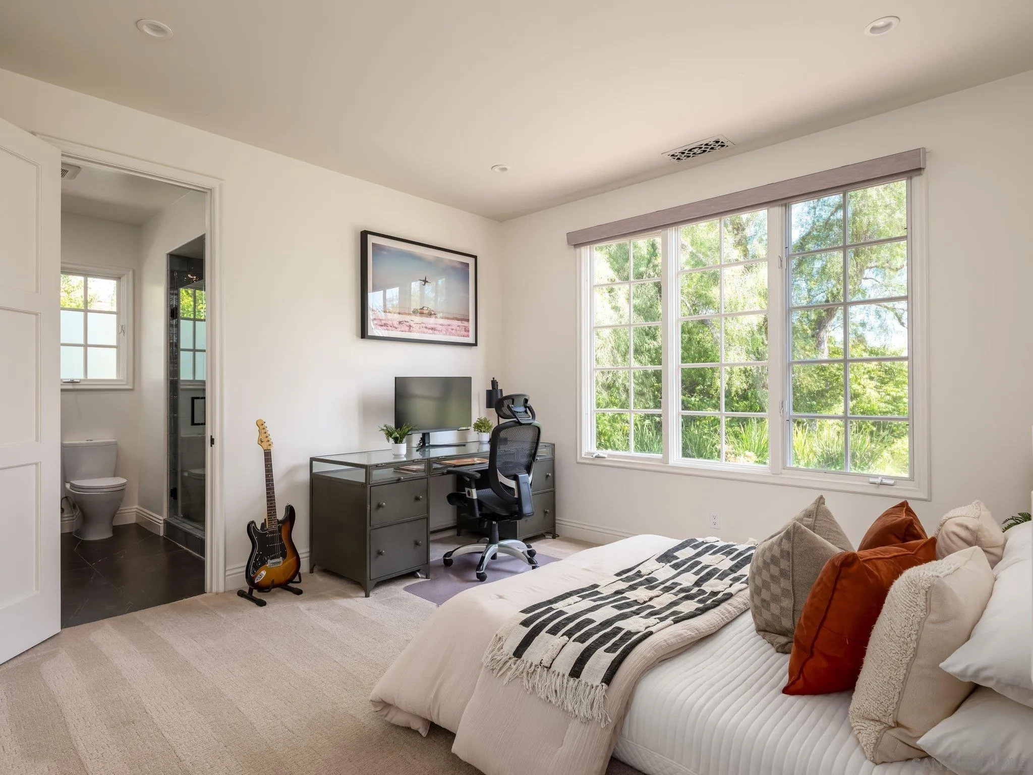 14910 Rancho Nuevo Del Mar, CA 92014 - Photo 27 of 60 a bed sitting in a bedroom next to a window