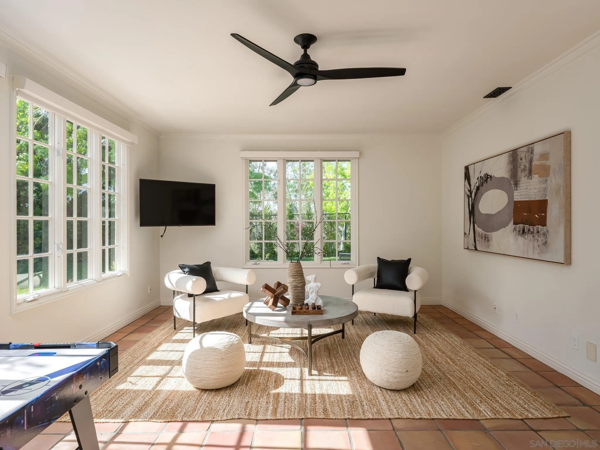 14910 Rancho Nuevo Del Mar, CA 92014 - Photo 33 of 60 a living room with furniture and a flat screen tv