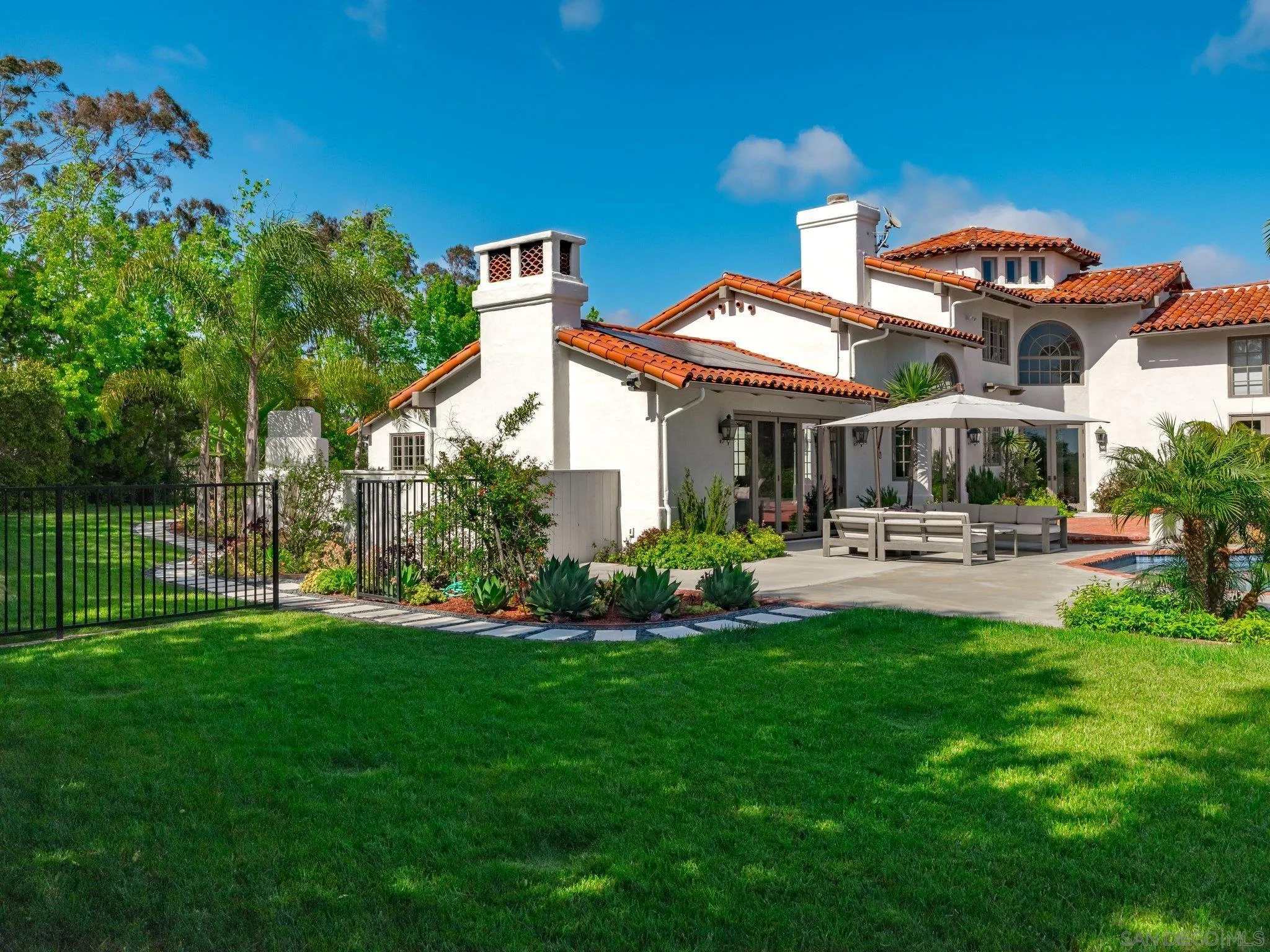14910 Rancho Nuevo Del Mar, CA 92014 - Photo 38 of 60 a front view of a house with swimming pool garden and patio