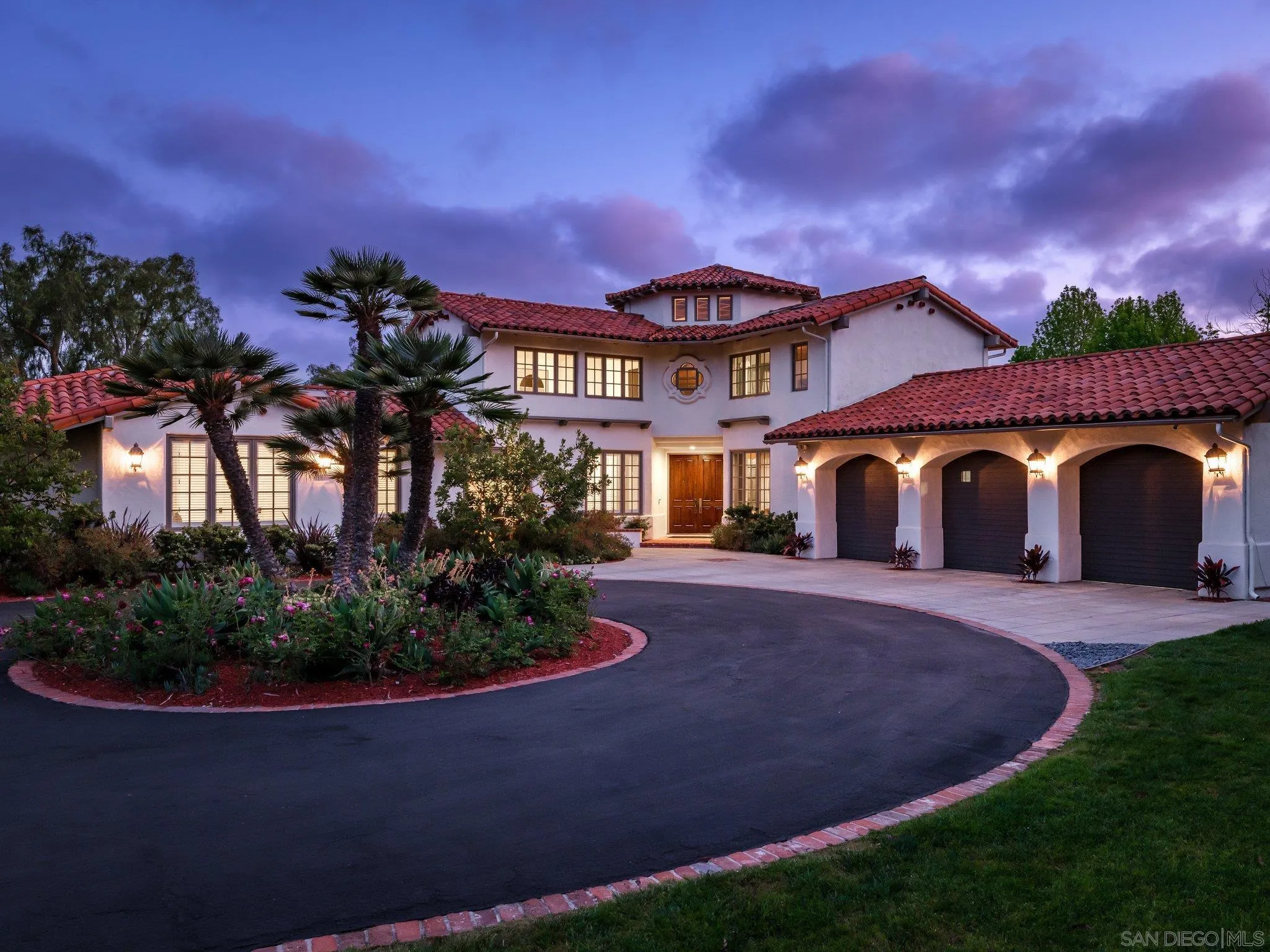14910 Rancho Nuevo Del Mar, CA 92014 - Photo 4 of 60 a front view of a house with a yard and garage