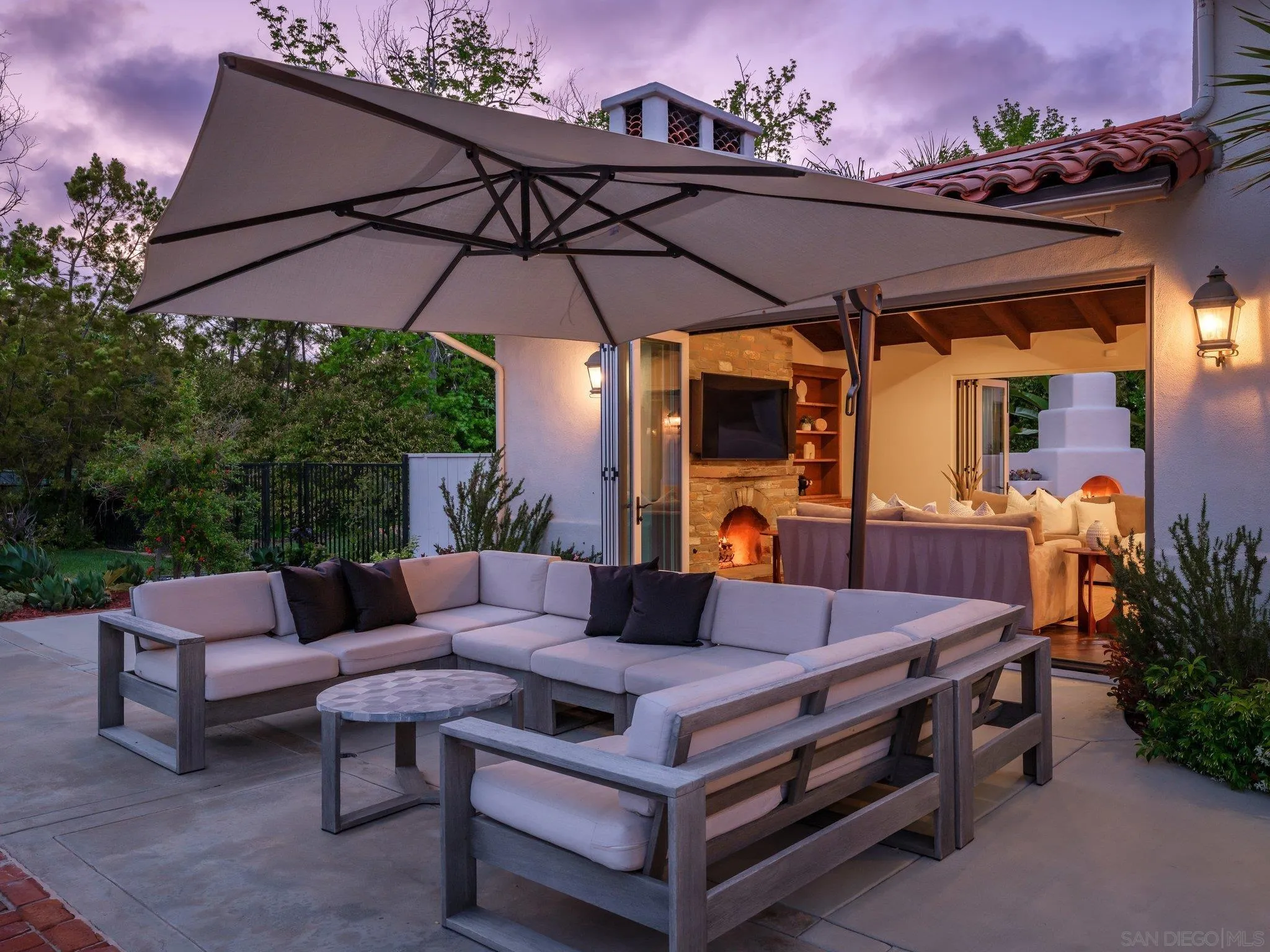 14910 Rancho Nuevo Del Mar, CA 92014 - Photo 58 of 60 a outdoor space with patio the couches and a umbrella