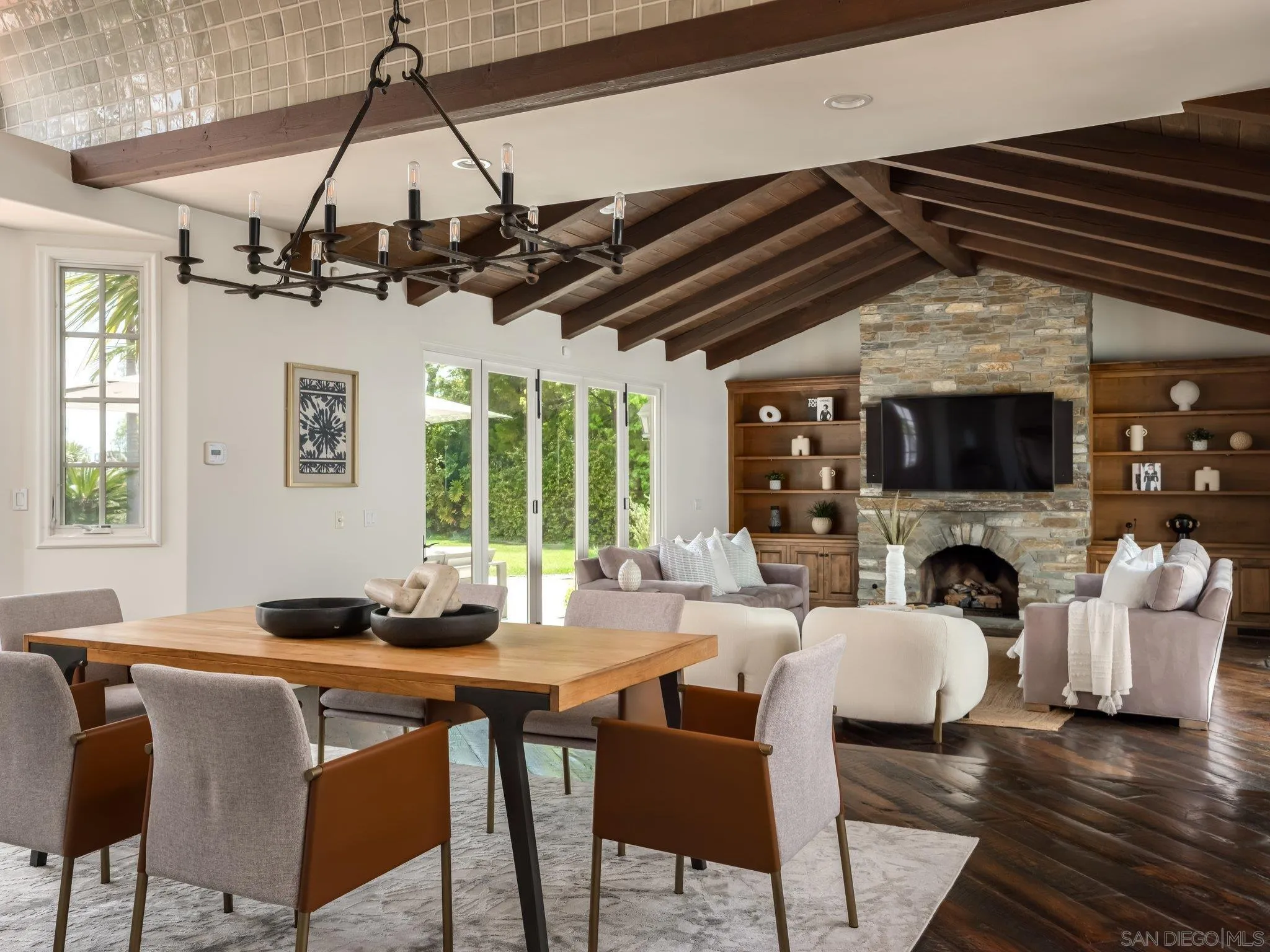 14910 Rancho Nuevo Del Mar, CA 92014 - Photo 7 of 60 a dining room with wooden floor a chandelier a wooden table and chairs