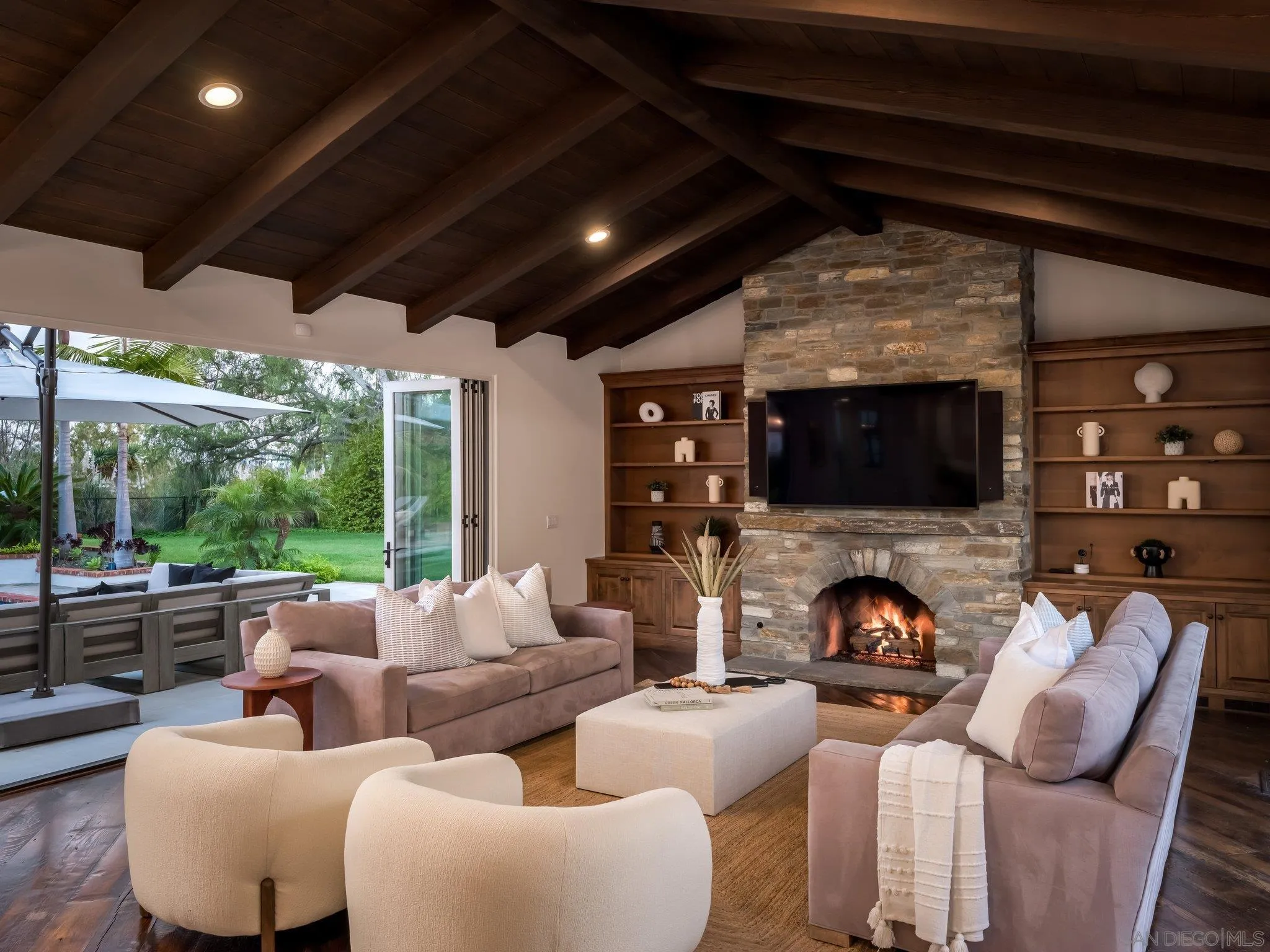 14910 Rancho Nuevo Del Mar, CA 92014 - Photo 8 of 60 a living room with furniture a fireplace and a flat screen tv