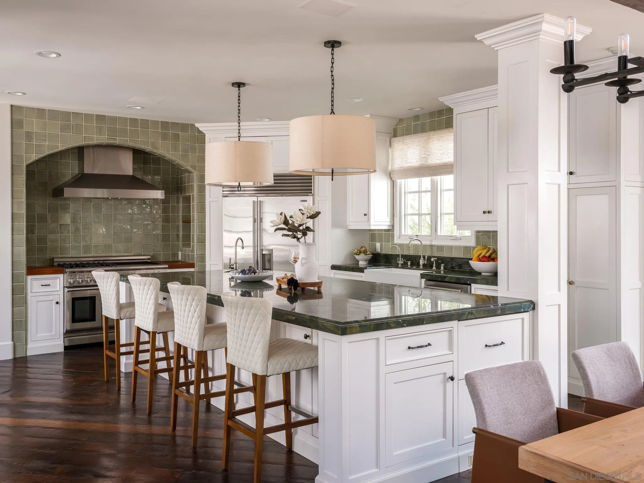 14910 Rancho Nuevo Del Mar, CA 92014 - Photo 9 of 60 a kitchen with stainless steel appliances kitchen island granite countertop a dining table chairs and sink
