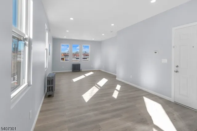 a view of livingroom and kitchen with hardwood floor