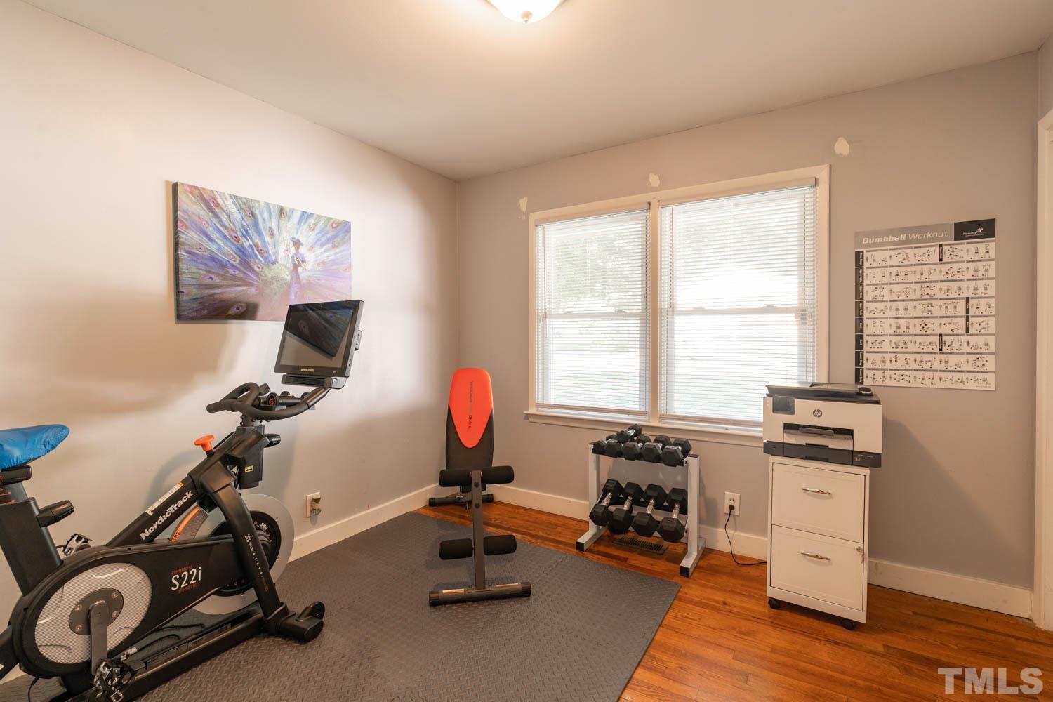 3137 Brentwood Road Raleigh, NC 27604 - Photo 8 of 19 a view of a workspace with gym equipment