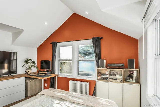 a large white kitchen with a large window
