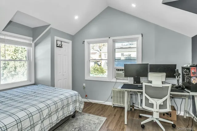 a bedroom with a bed and a table in it