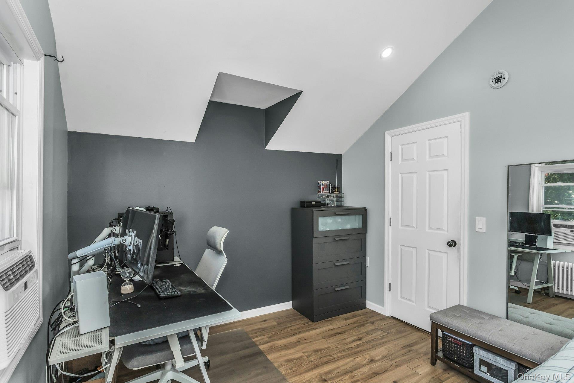 42 13th Street Locust Valley, NY 11560 - Photo 21 of 34 Office space with light wood finished floors, lofted ceiling, recessed lighting, cooling unit, and radiator heating unit