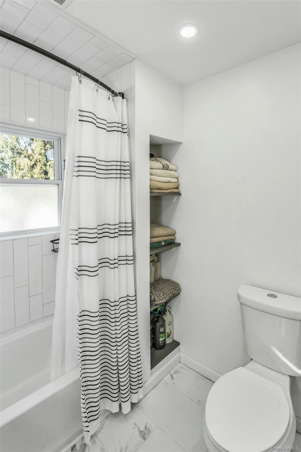 42 13th Street Locust Valley, NY 11560 - Photo 24 of 34 Full bathroom featuring shower / bath combination with curtain, light marble finish floors, and recessed lighting