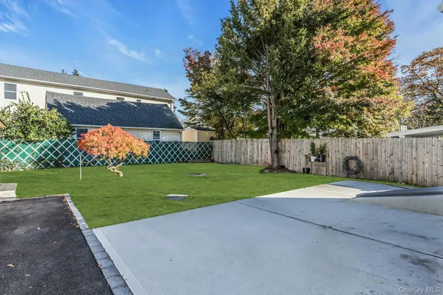 a view of outdoor space with backyard and green space