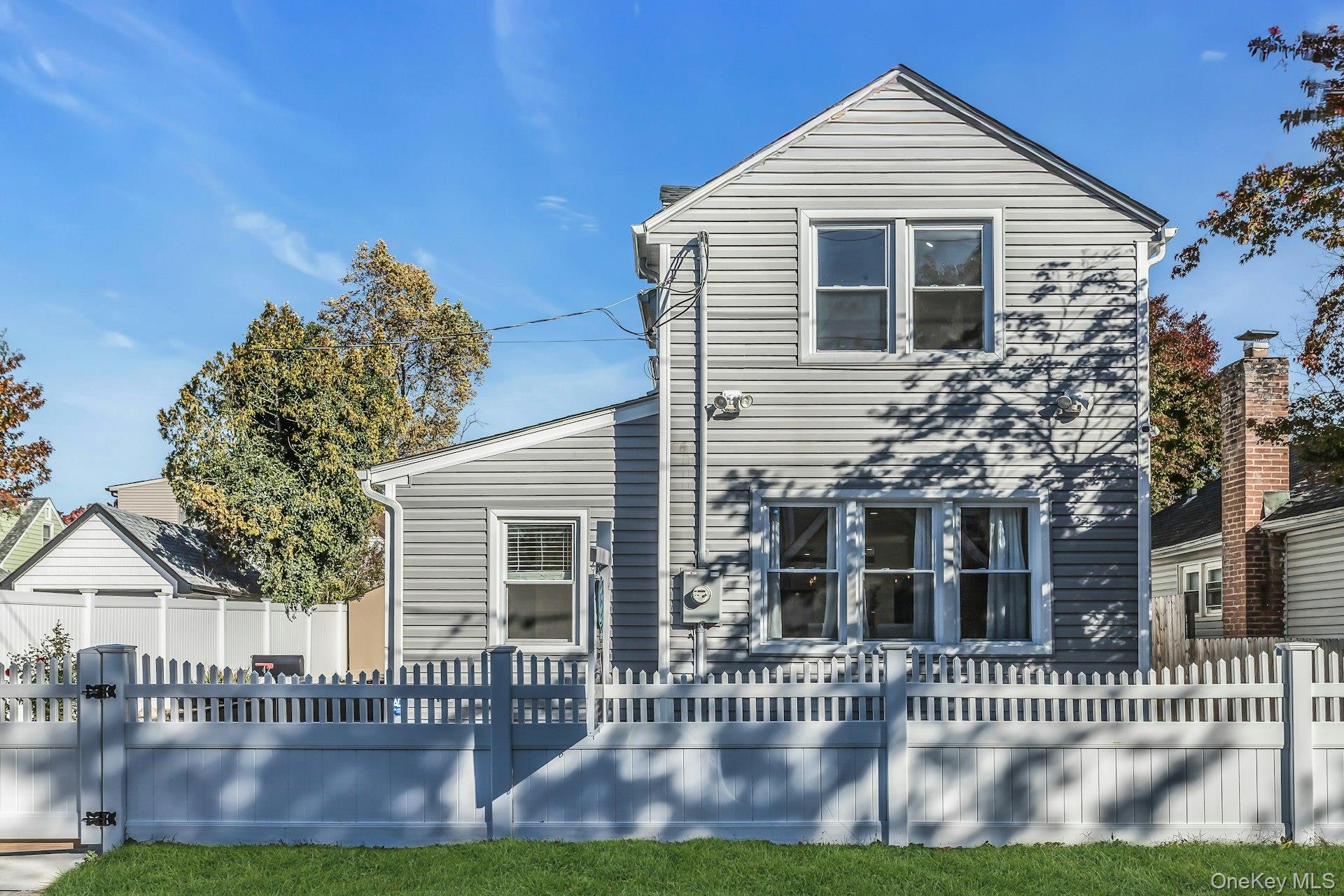 42 13th Street Locust Valley, NY 11560 - Photo 3 of 34 View of front of house featuring a fenced front yard