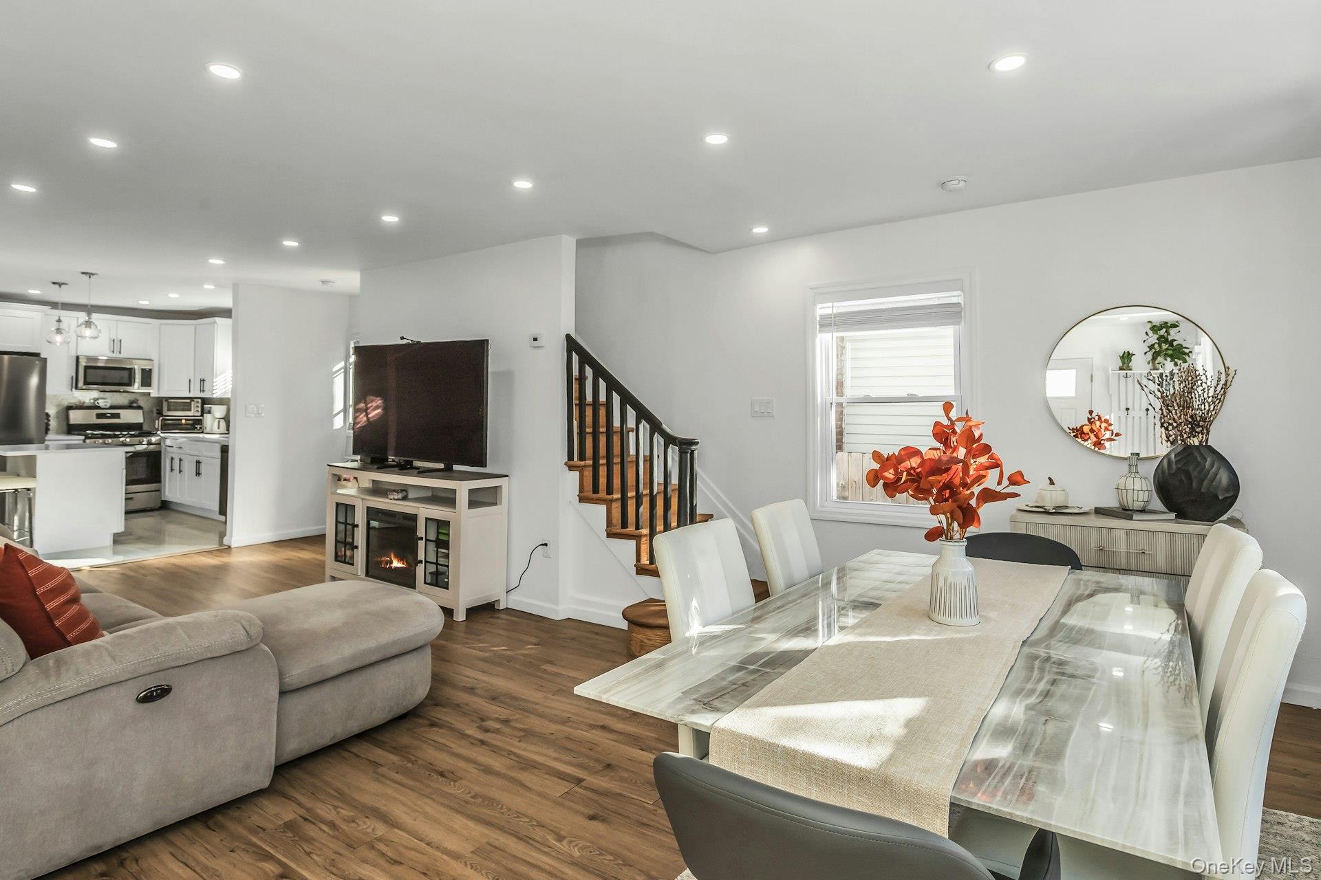 42 13th Street Locust Valley, NY 11560 - Photo 5 of 34 Dining room featuring recessed lighting, dark wood-style flooring, and stairs