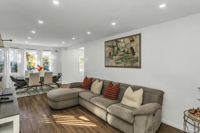 a living room with furniture and a rug