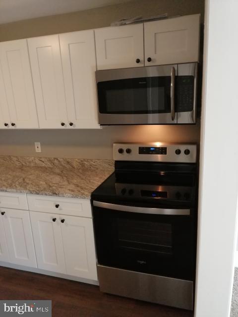 4329 Main Street, Unit 2 Philadelphia, PA 19127 - Photo 3 of 5 a stove top oven sitting inside of a kitchen