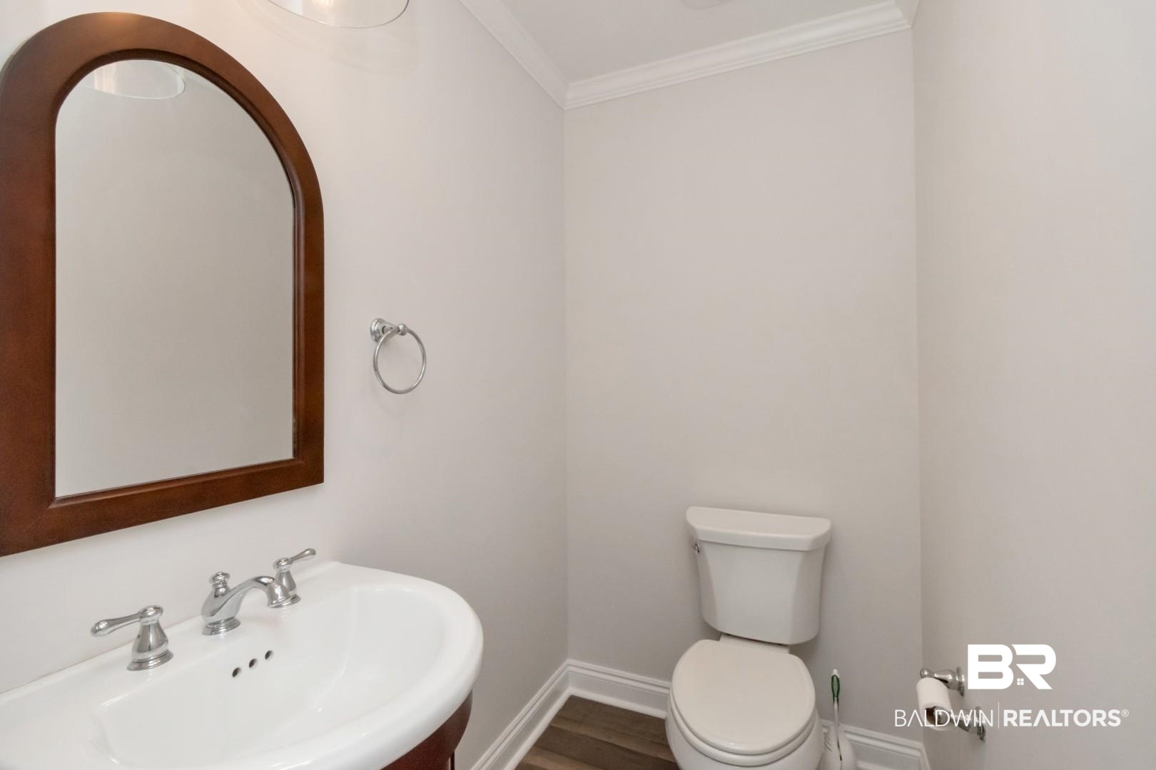 231 Rochester Road Mobile, AL 36608 - Photo 17 of 51 Half bath featuring crown molding and dark wood-style floors