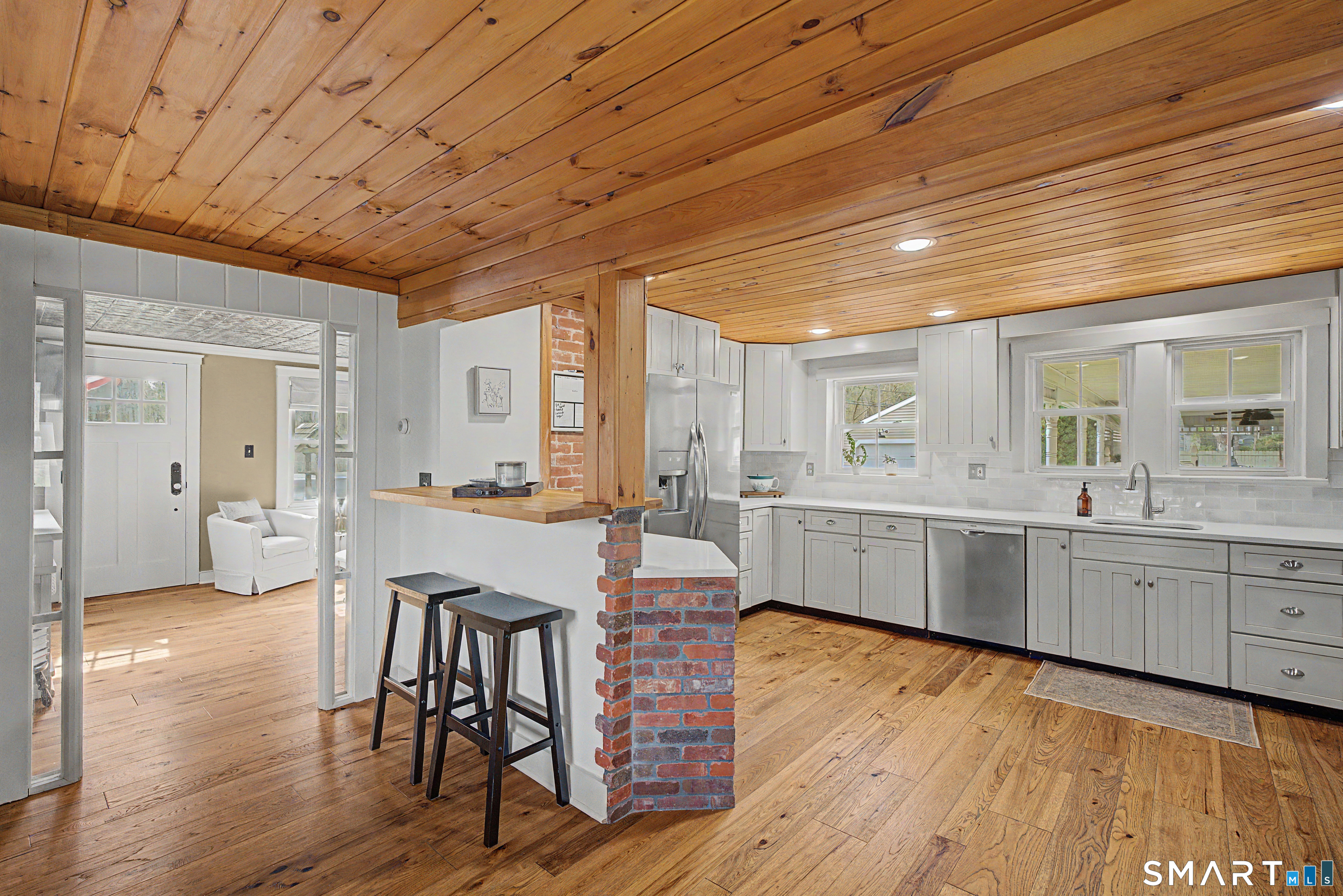 602 Durham Road Madison, CT 06443 - Photo 15 of 34 Added bar top seating for everyday convenience