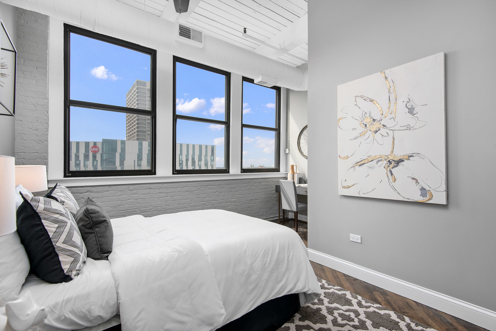 411 South Sangamon Street, Unit 7C Chicago, IL 60607 - Photo 11 of 15 a bedroom with a bed and a painting on the wall