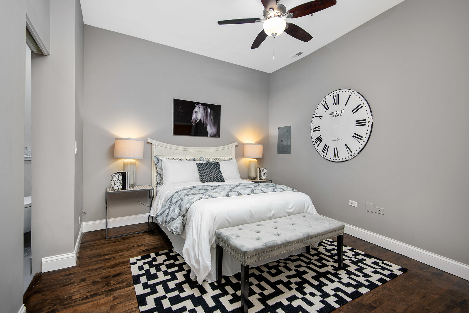 411 South Sangamon Street, Unit 7C Chicago, IL 60607 - Photo 14 of 15 a bedroom with a large bed and a chandelier