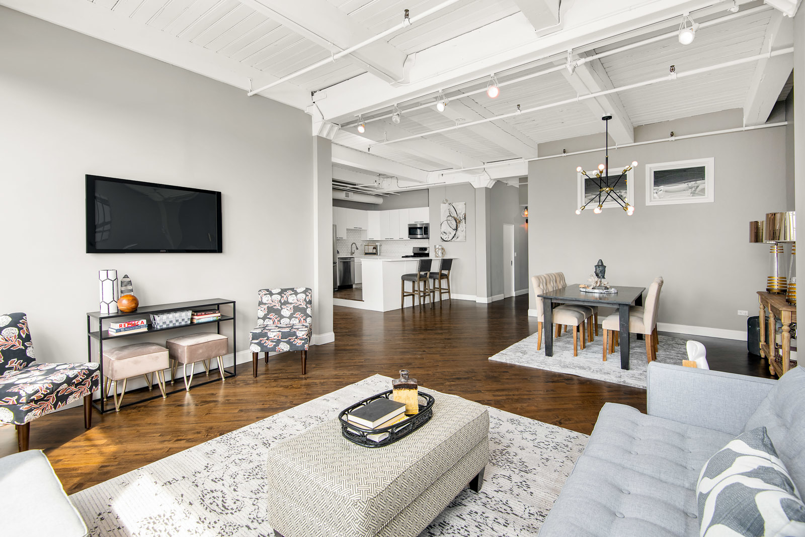 411 South Sangamon Street, Unit 7C Chicago, IL 60607 - Photo 2 of 15 a living room with furniture and a flat screen tv