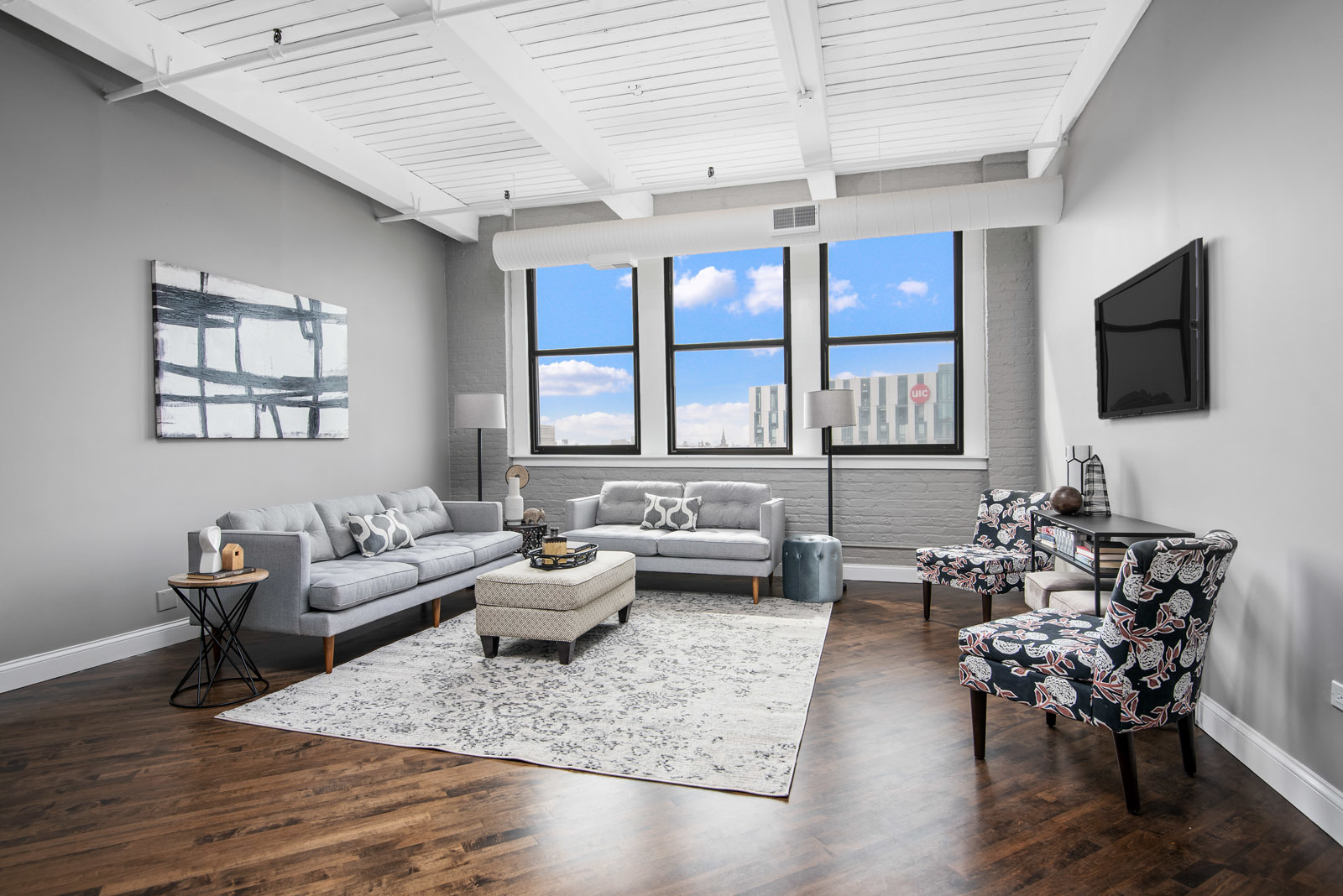 411 South Sangamon Street, Unit 7C Chicago, IL 60607 - Photo 3 of 15 a living room with furniture and large windows
