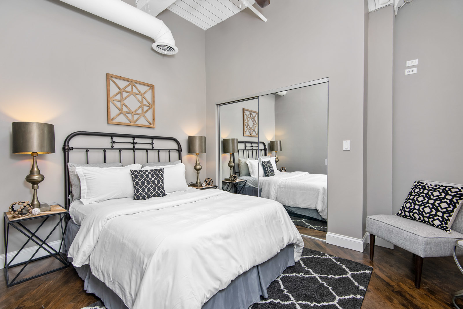 411 South Sangamon Street, Unit 7C Chicago, IL 60607 - Photo 9 of 15 a bedroom with double bed and a night stand