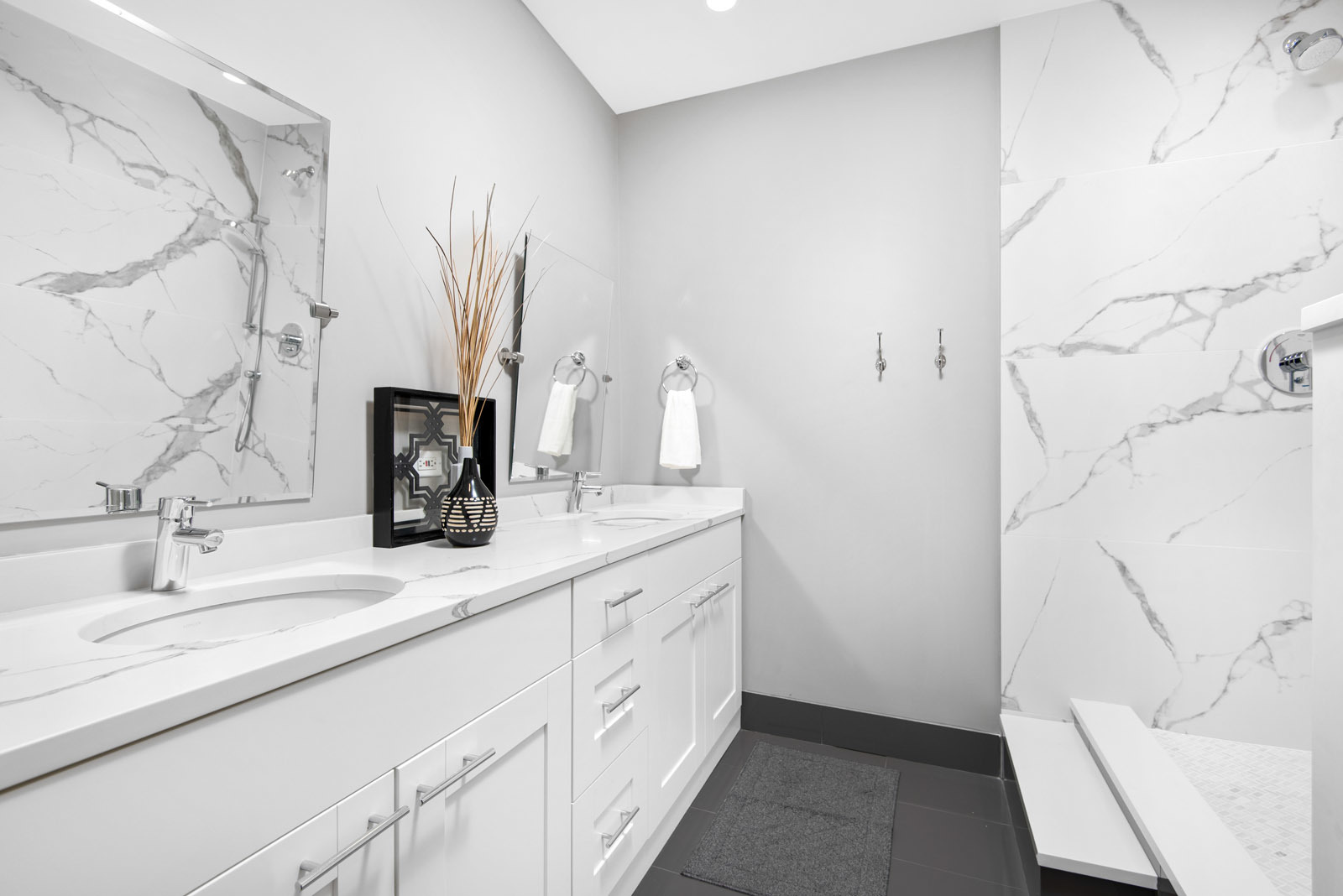 411 South Sangamon Street, Unit 7C Chicago, IL 60607 - Photo 10 of 15 a bathroom with a double vanity sink a toilet and a mirror