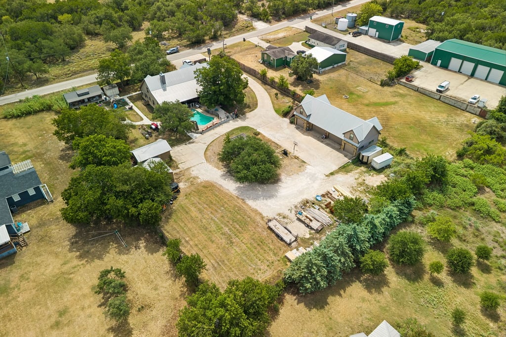 10111 Signal Hill Road Austin, TX 78737 - Photo 39 of 40 An expansive aerial perspective showcases the complete property layout, outbuildings, and private swimming pool.