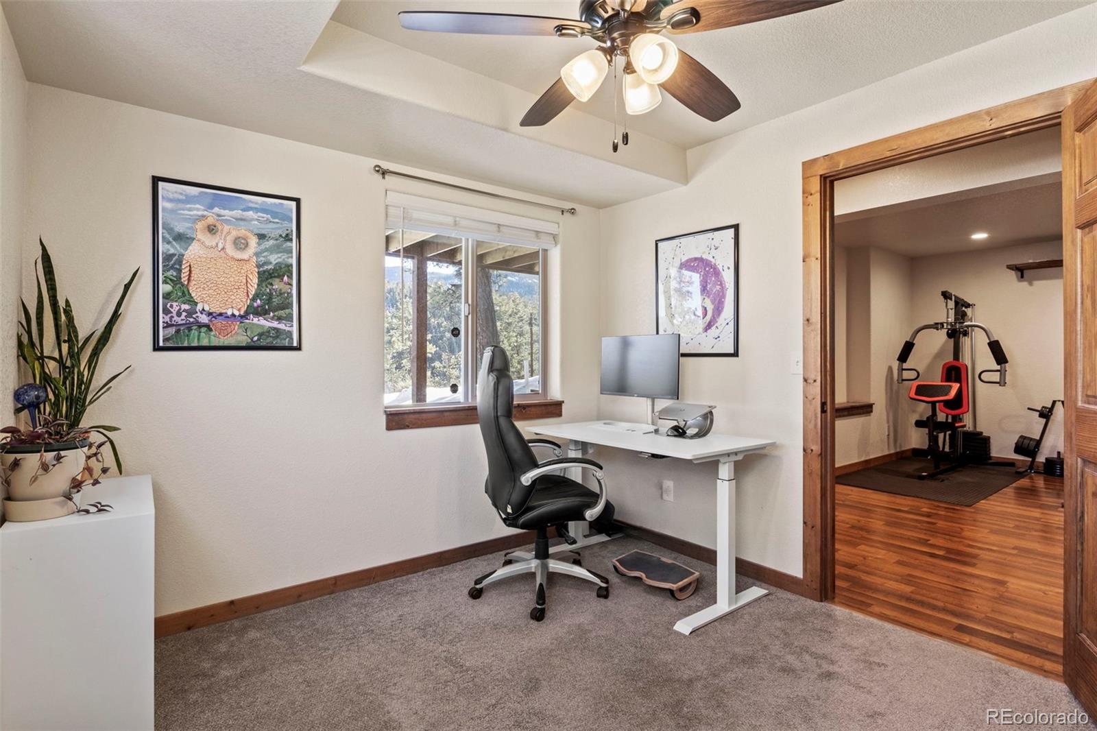 200 Virginia Road Bailey, CO 80421 - Photo 30 of 49 a view of a workspace with furniture and a livingroom