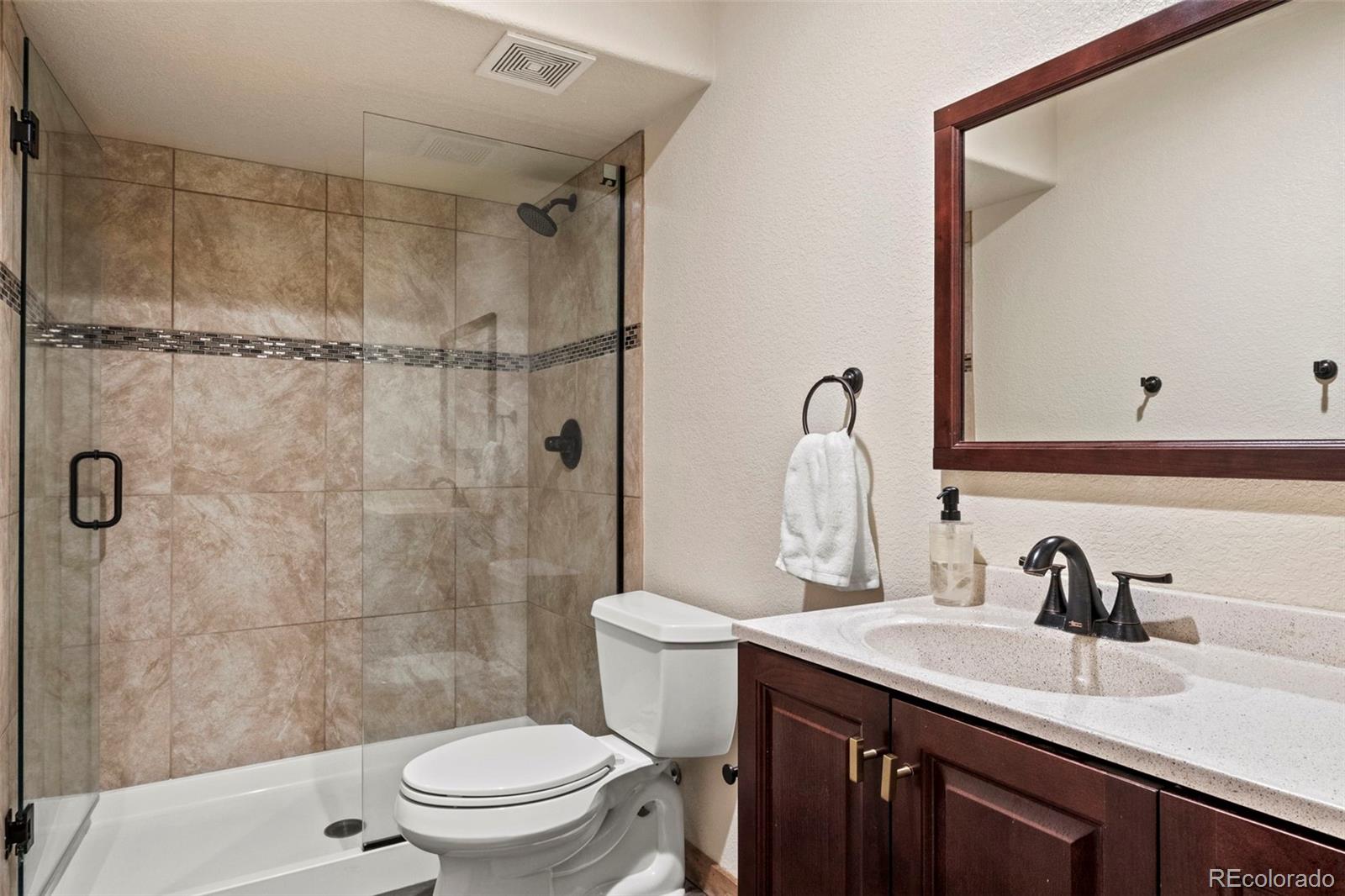 200 Virginia Road Bailey, CO 80421 - Photo 32 of 49 a bathroom with a sink toilet and shower