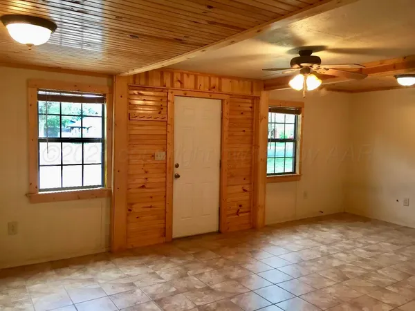 an empty room with windows