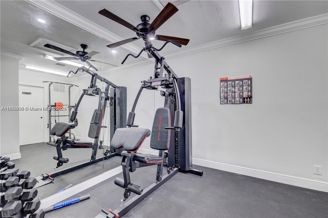 2860 Northeast 14th Street Causeway, Unit 406D Pompano Beach, FL 33062 - Photo 17 of 25 a view of a room with gym equipment