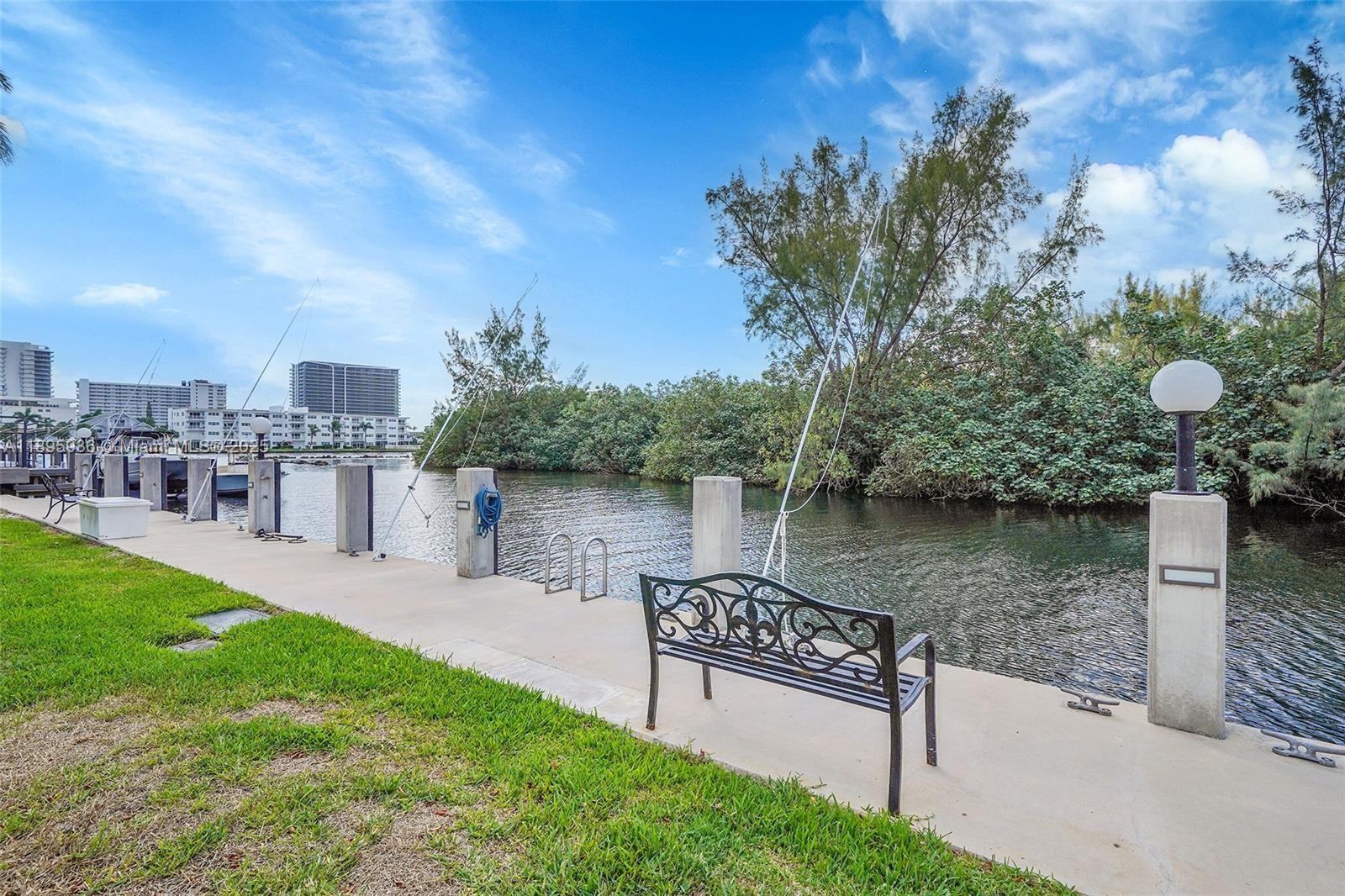 2860 Northeast 14th Street Causeway, Unit 406D Pompano Beach, FL 33062 - Photo 21 of 25 a view of a lake from a yard