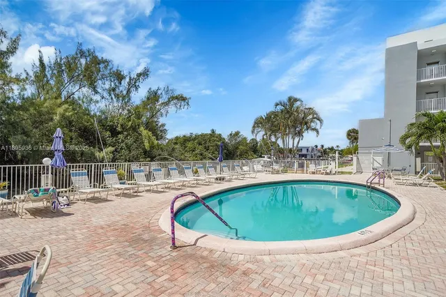 a view of swimming pool with outdoor seating