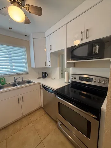 a kitchen with a stove and a sink